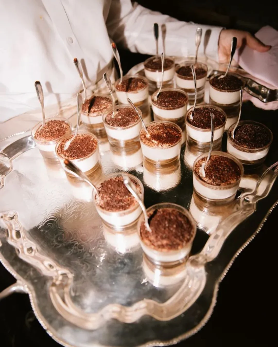 Sparkling welcome drinks on a silver serving tray