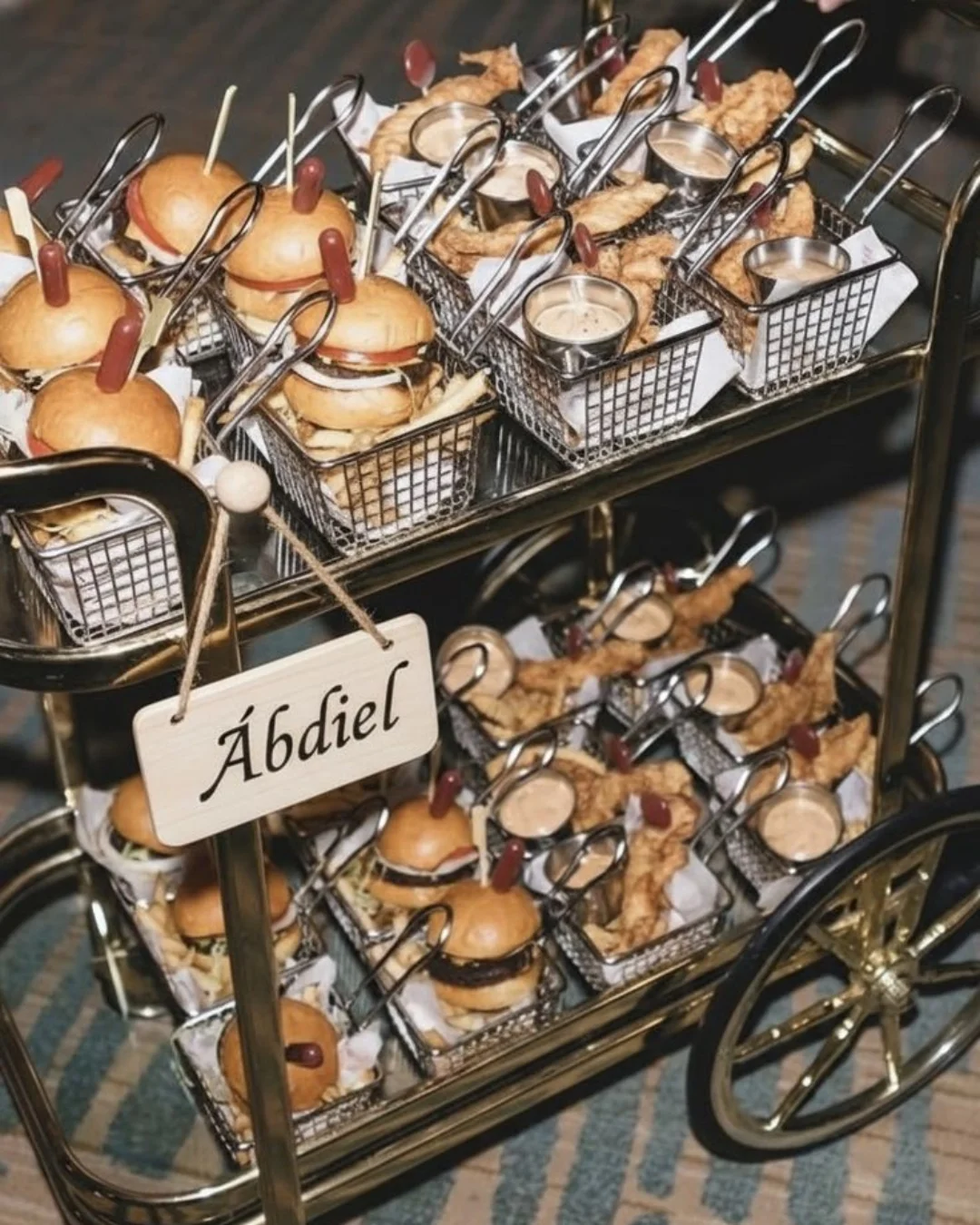 A rolling food cart filled with freshly prepared small bites